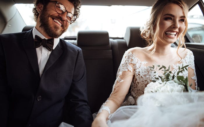 newly weds drive to their raleigh wedding reception