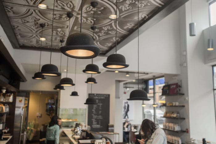 Eclectic bowler hat lights at 42 & Lawrence, one of the best coffee shops in Raleigh, NC