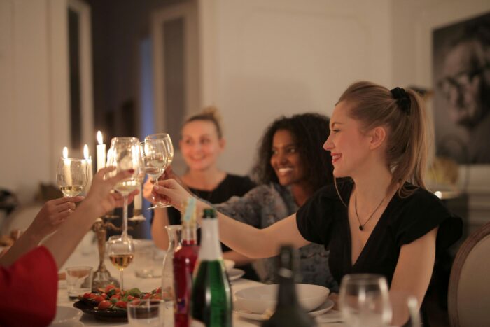 families celebrating at dinner after graduation